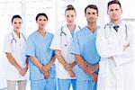 Portrait of serious confident group of doctors standing at the medical office