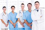 Portrait of confident happy group of doctors standing at the medical office