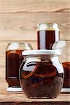 Jars with healthy, freshly made dandelion syrup â?? alternative medicine for cough, cold or flu
