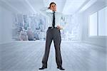 Thinking businessman with hand on head against city scene in a room