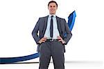 Cheerful businessman with hands on hips against blue arrow pointing up