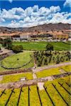 Overview of garden and grounds at Qurikancha, Convent of Santo Domingo, and street scene in background, Cusco, Peru