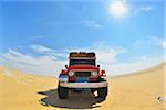 Four Wheel Drive Car in Desert with Sun, Matruh Governorate, Libyan Desert, Sahara Desert, Egypt, Africa