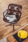 Retro brown leather armchair and vinyl records