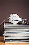 Stack of vinyl records with headphones