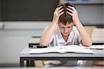 Schoolboy struggling in educational exam