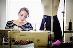 Seamstress working at sewing machine