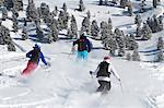 Group of friends skiing in powder snow in Kuhtai, Austria