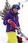 Woman putting on skis; ski touring in Kuhtai, Tirol, Austria