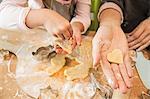 Mother and daughter baking in kitchen