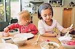 Children baking in kitchen