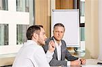 Businessmen meeting in conference room