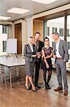 Businesspeople standing in conference room