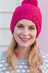 Portrait of young woman in wooly hat