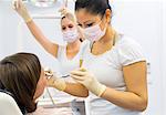 Dentist working on female patient