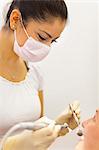 Female dentist working on patient