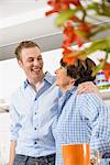 Adult grandson and grandmother in kitchen