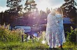 Two young adult female friends wrapped in blanket, Gavle, Sweden