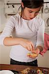 Girl decorating Christmas cookies, Munich, Bavaria, Germany