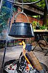 Cooking Pot Hanging On Hook Over Bonfire