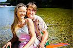 Happy young couple in a canoe, portrait, Bavaria, Germany
