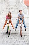Young couple with bicycles, having fun, Osijek, Croatia