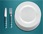 empty white plates with knife and fork on blue background.