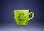 Green tea mug or cup with recycle sign on it, environmental conceptual image.