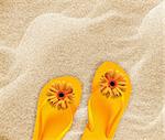 a pair of flip flops on the beach sand, Summer back concept.