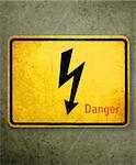 yellow high voltage Alert sign on wall.