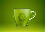 Green tea mug or cup with recycle sign on it, environmental conceptual image.