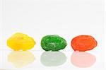 colored sweet fruits on a white background