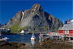 Picturesque fishing town of Reine on the coast of fjord on Lofoten islands in Norway