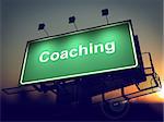 Coaching - Green Billboard on the Rising Sun Background.