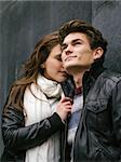 Photo of a happy couple in love outdoors during autumn.  Shallow depth of field with focus on the woman. Photo is from the PhotoWalk in Berlin during Microstock Expo.