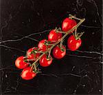 Vine tomatoes on marble table