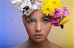Beautiful woman in wreath of flowers of different