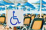 sign wheelchair close-up on the beach