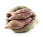 sweet potatoes in burlap sack isolated on white background