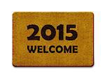 Happy new year 2015, welcome doormat carpet isolated on white. the same concept available for 2016 year. (clipping path included)