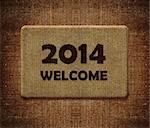 Happy new year 2014, welcome doormat carpet isolated on white. the same concept available for 2015 and 2016 year. (clipping path included)