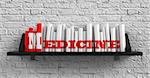 Medicine - Red Inscription on the Books on Shelf on the White Brick Wall Background. Education Concept.