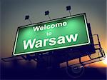 Welcome to Warsaw - Green Billboard on the Rising Sun Background.