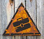 Briefcase Icon on Weathered Triangular Yellow Warning Sign. Grange Background.