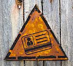 ID Card Icon on Weathered Triangular Yellow Warning Sign. Grange Background.