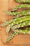 Bunch of fresh asparagus on cutting board