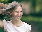 young girl holding her hair in hand, vintage toned photo