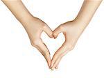 female teen hand makes heart shape with hands, white background