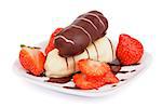 Arrangement of Glazed Chocolate Eclairs with Chocolate Sauce and Sliced Strawberry on White Plate closeup on white background