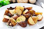 Roasted potato and mushrooms on a plate